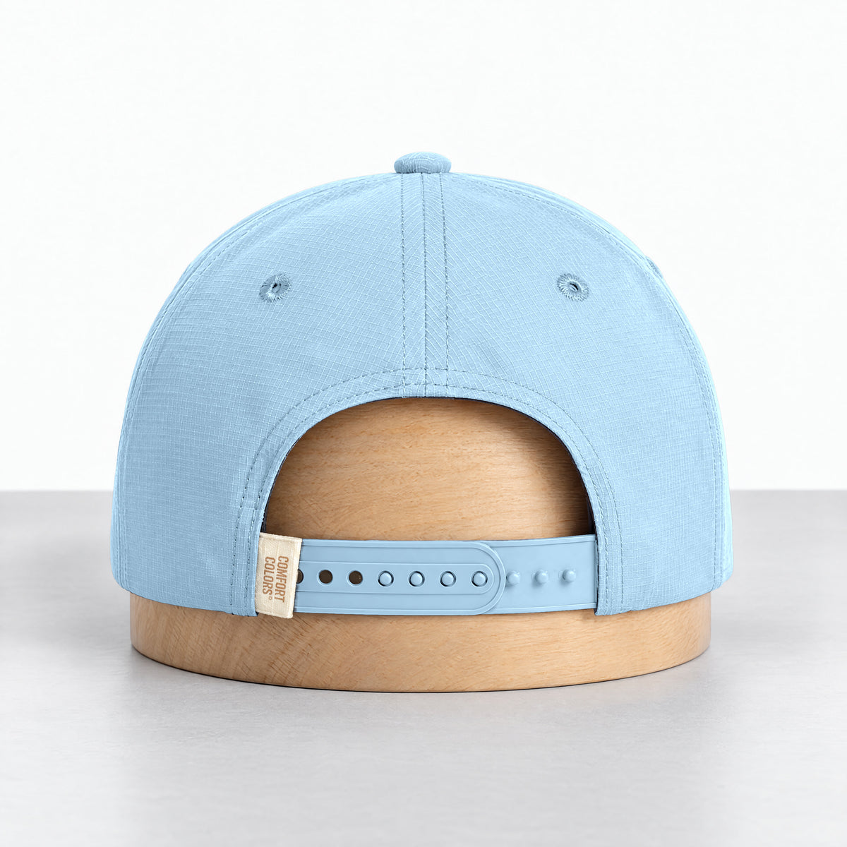Chambray rope hat, back view with the adjustable snapback and Comfort Colors label