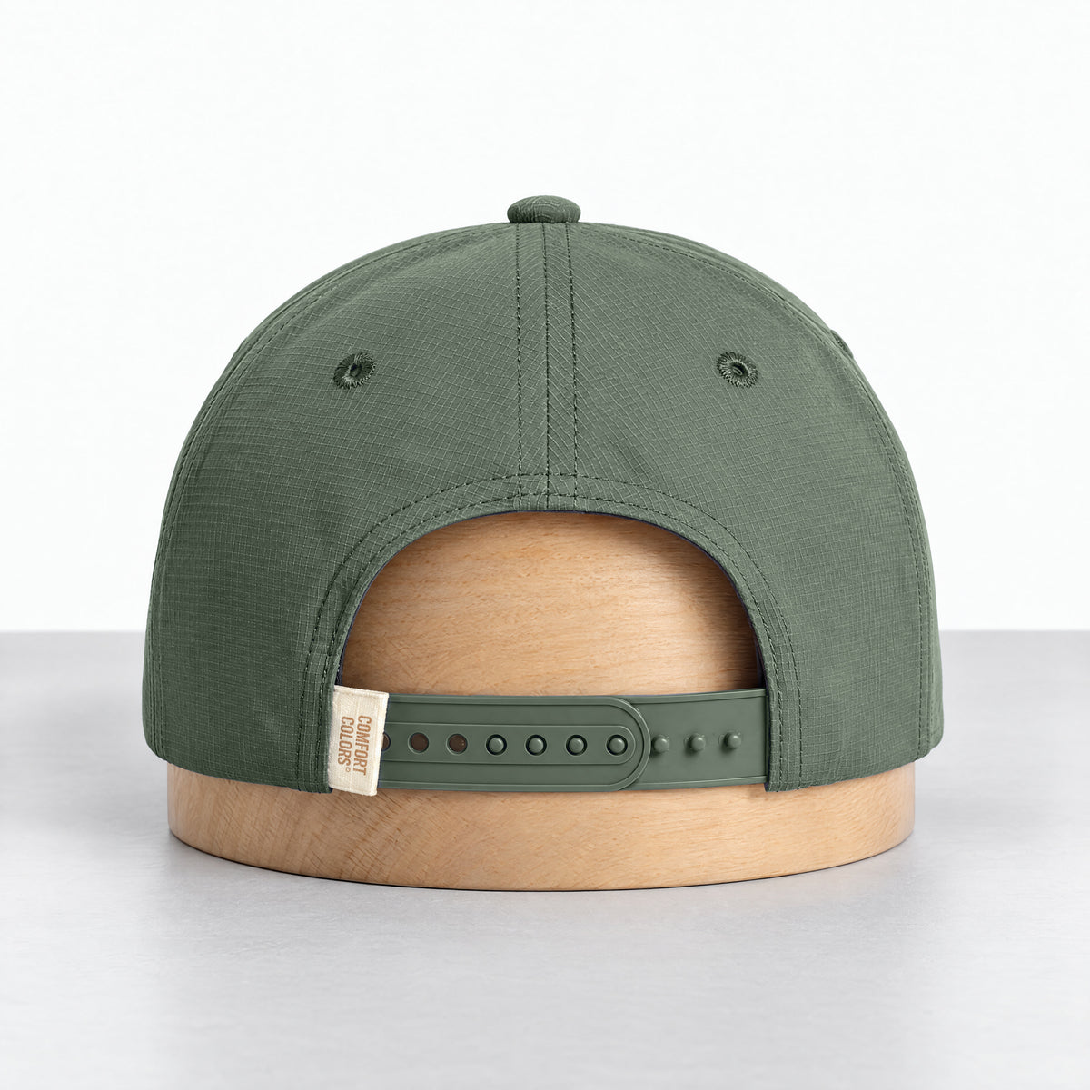 Moss rope hat, back view with the adjustable snapback and Comfort Colors label
