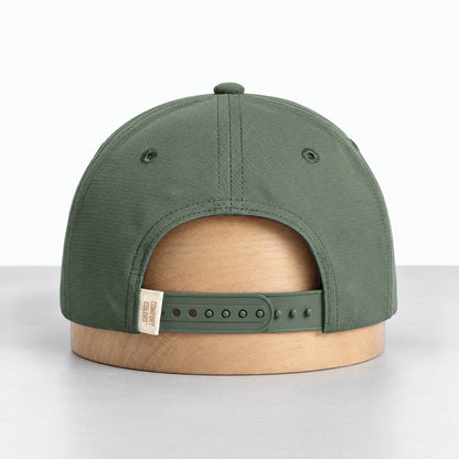 Moss rope hat, back view with the adjustable snapback and Comfort Colors label